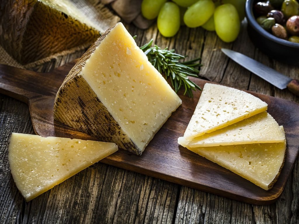 manchego cheese in wooden tray image