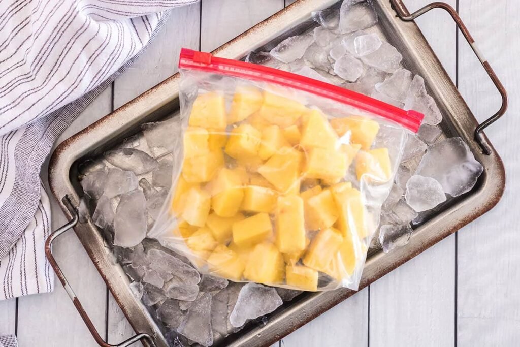 frozen-pineapple-chunks on ice-kookybakes.com