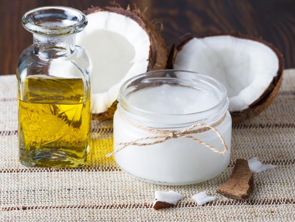 coconut with its oil in small glass bowl