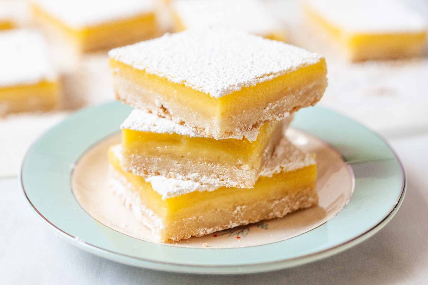 lemon bars served on plate-kookybakes.com