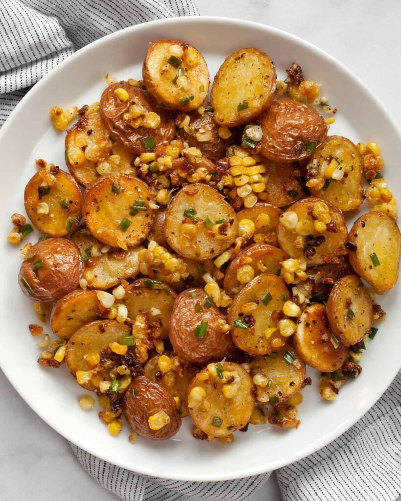 roasted-red-potato-salad-with-corn served in plate-kookybakes.com