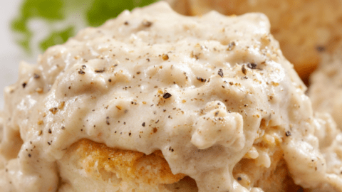 Hardees Gravy Recipe with seasoning sprinkled over it-kookybakes.com