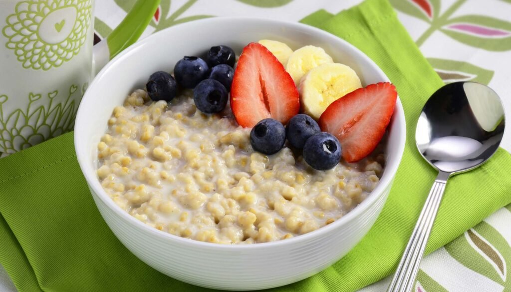 RICE COOKER STEEL-CUT OATMEAL served in bowl and garnished with fruits-kookybakes.com